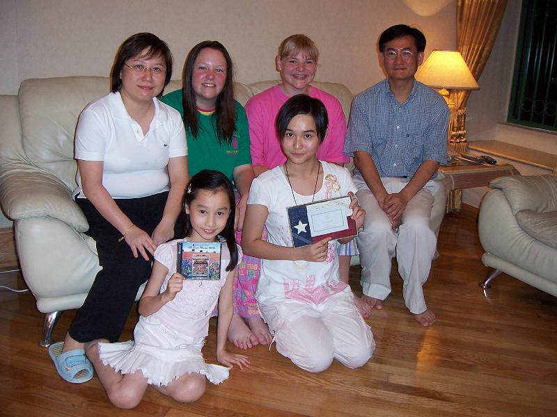 2006 - Texas Girls' Choir Long Tour, Hong Kong, China - Stephanie & Brett with their host family.jpg